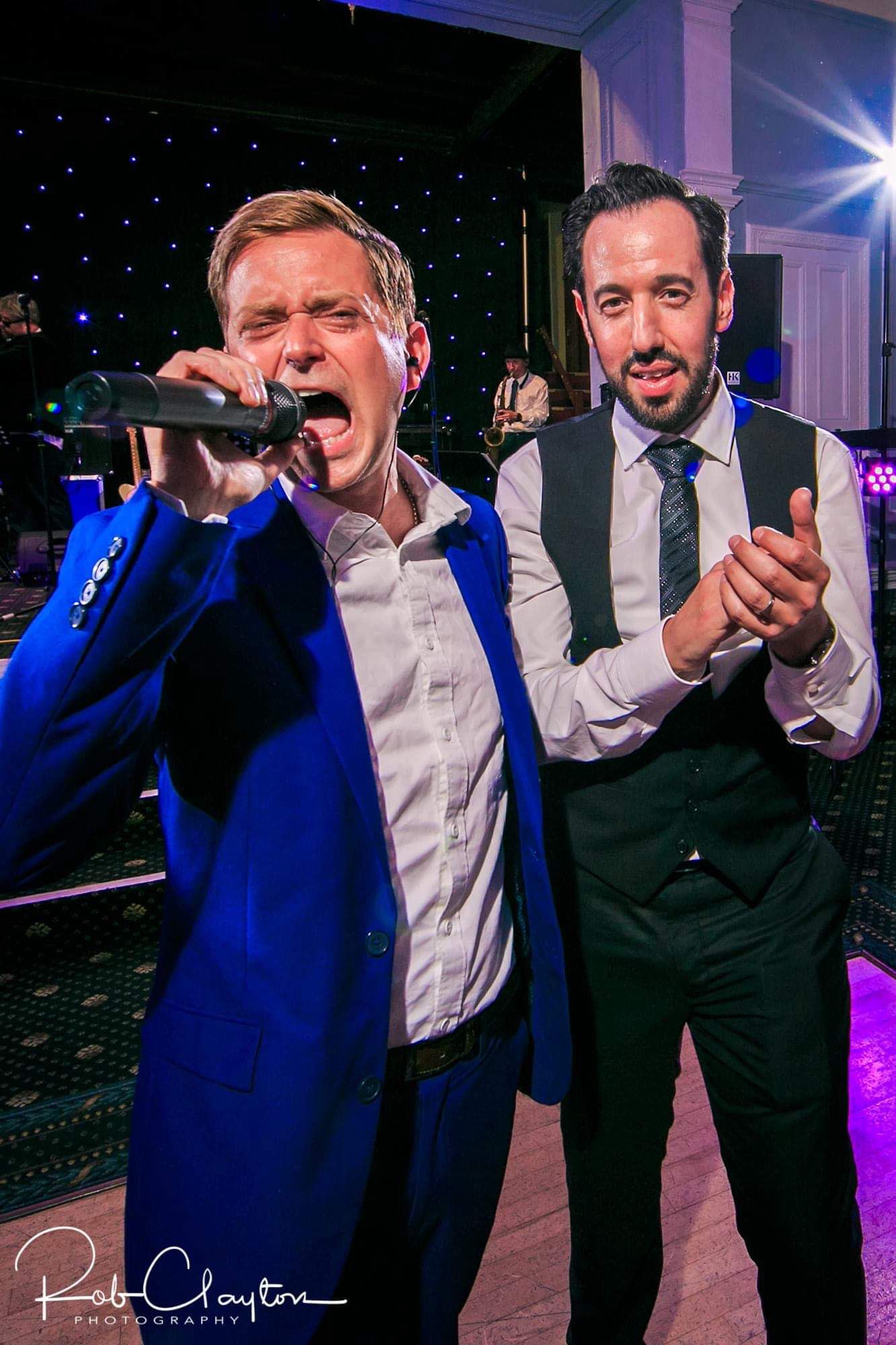 Ilan singing live with another performer at a Jewish celebration